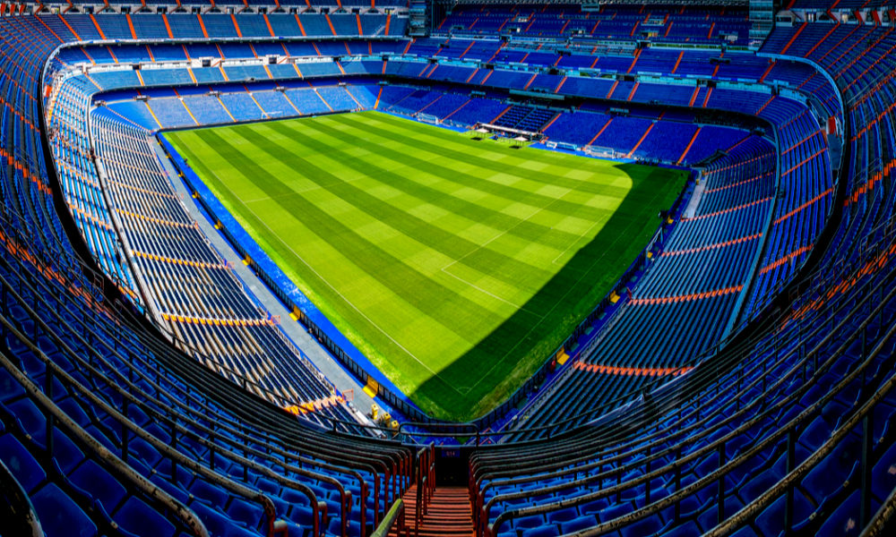 The Santiago Bernabéu Stadium, home to Real Madrid, is an iconic football venue located in Madrid, Spain. Hosting matches for one of the most prestigious football clubs globally, it stands as a symbol of excellence and achievement in the sport. With a rich history and a capacity to accommodate thousands of passionate fans, the stadium serves as a stage for thrilling matches, epic rivalries, and unforgettable moments. Key words: Santiago Bernabéu Stadium, Real Madrid, football venue, Madrid, Spain, iconic, matches, fans.