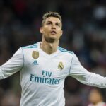 "Football Royalty: Cristiano Ronaldo in Champions League Action" In this captivating image, Cristiano Ronaldo, the football icon, is